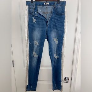 Blue jeans with white tassels